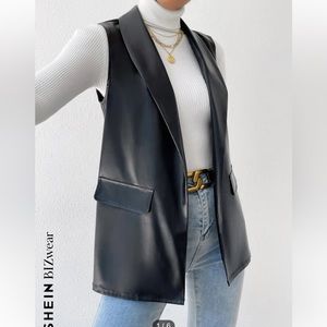 Never been worn, faux leather vest.